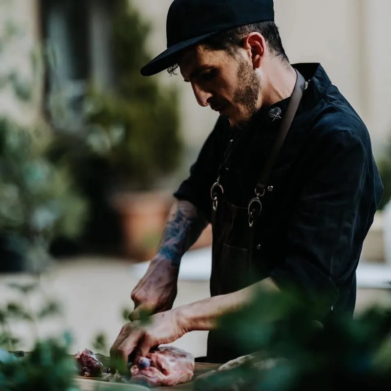 Marco Genna chopping herbs