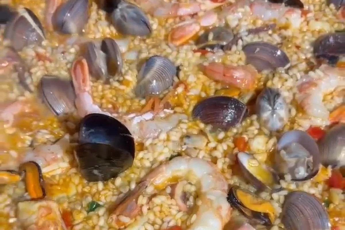 Seafood paella — mussels, prawns and clams in saffron rice